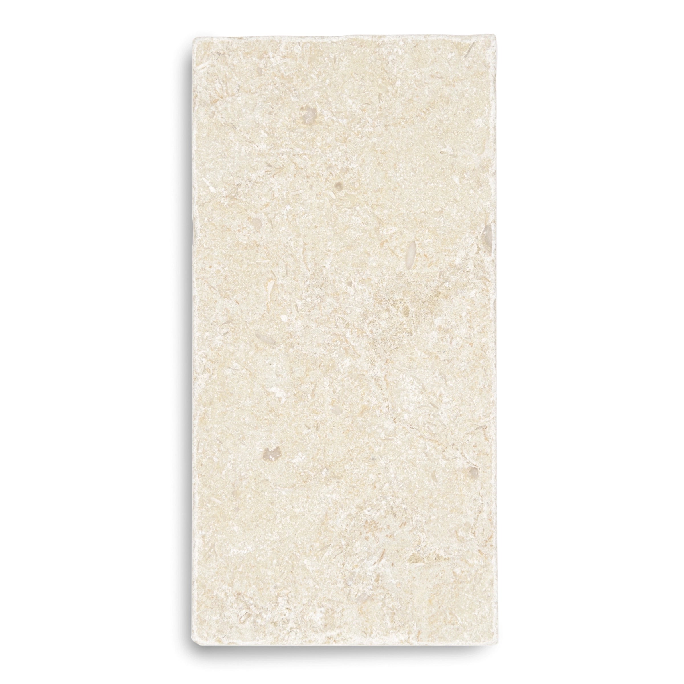 Single rectangular tumbled stone tile in soft beige tones with natural subtle texture and faint mineral patterns