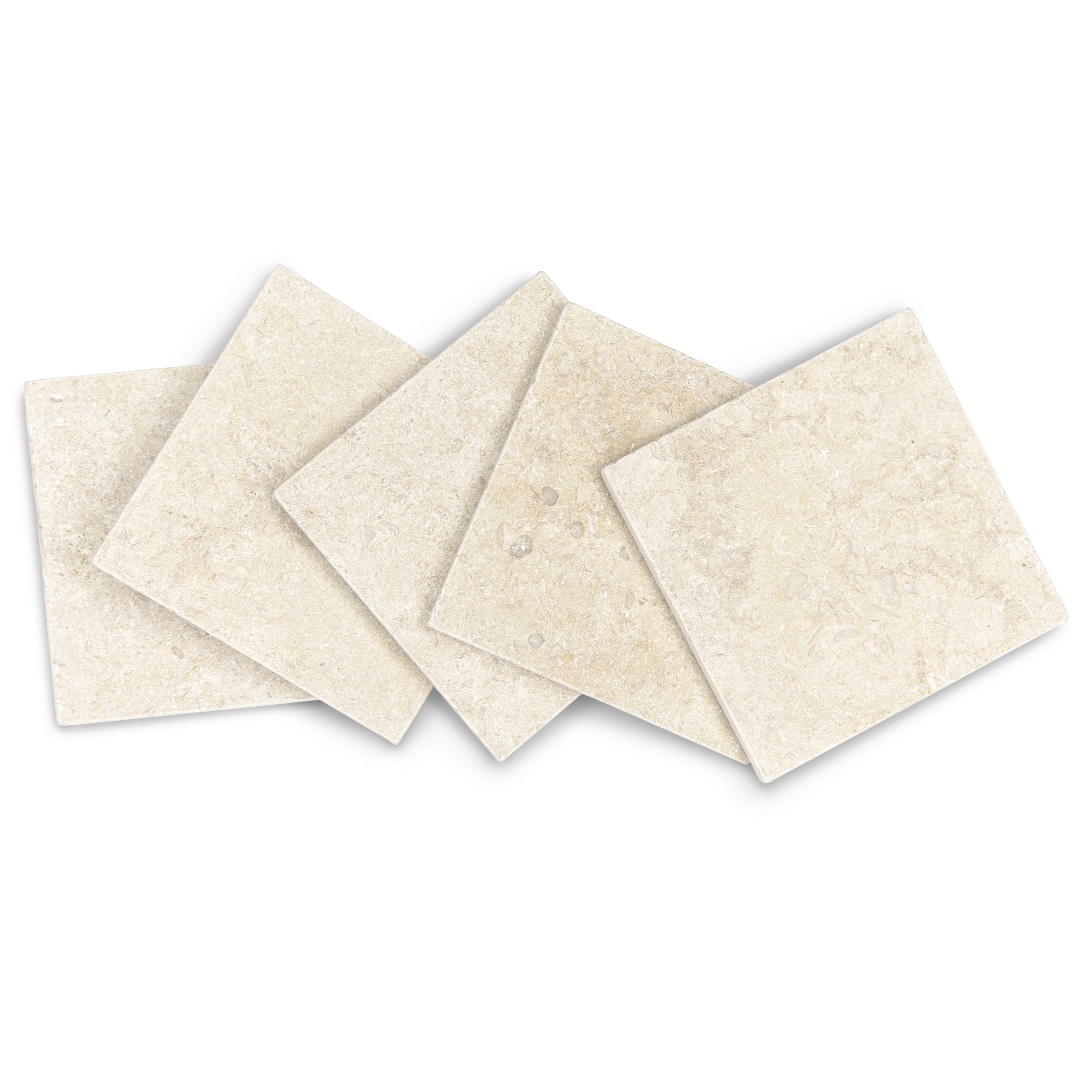 Five light cream stone tiles with natural texture and subtle mineral and fossil details arranged overlapping on white background