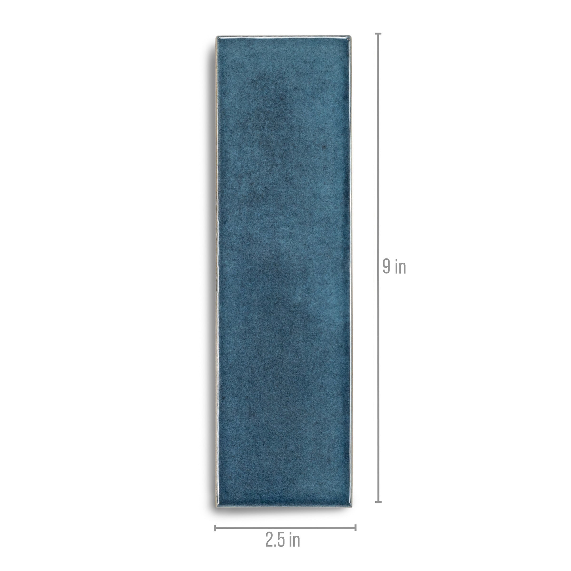 Narrow rectangular ceramic tile in deep ocean blue with a smooth matte surface and visible size markings