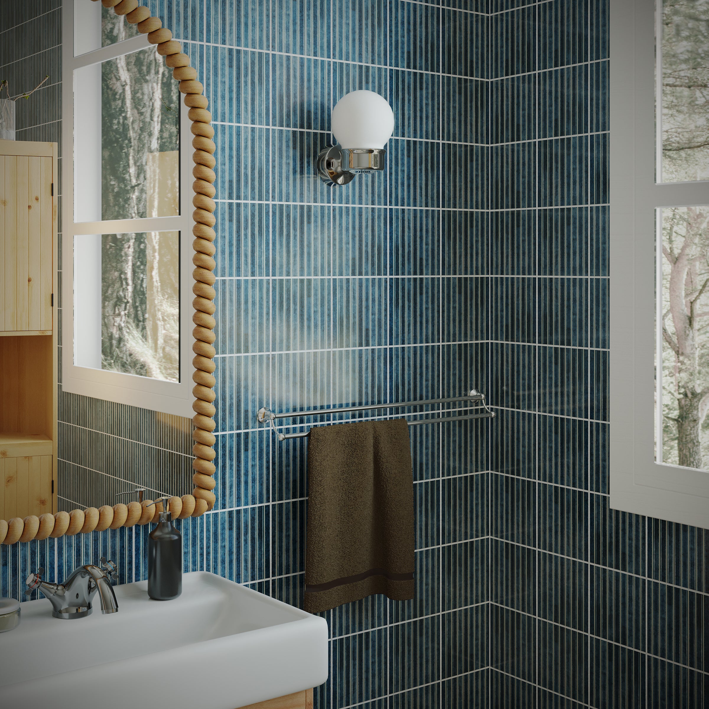 Slim vertical ceramic tiles in deep ocean blue creating a textured wall surface around a white bathroom sink and mirror