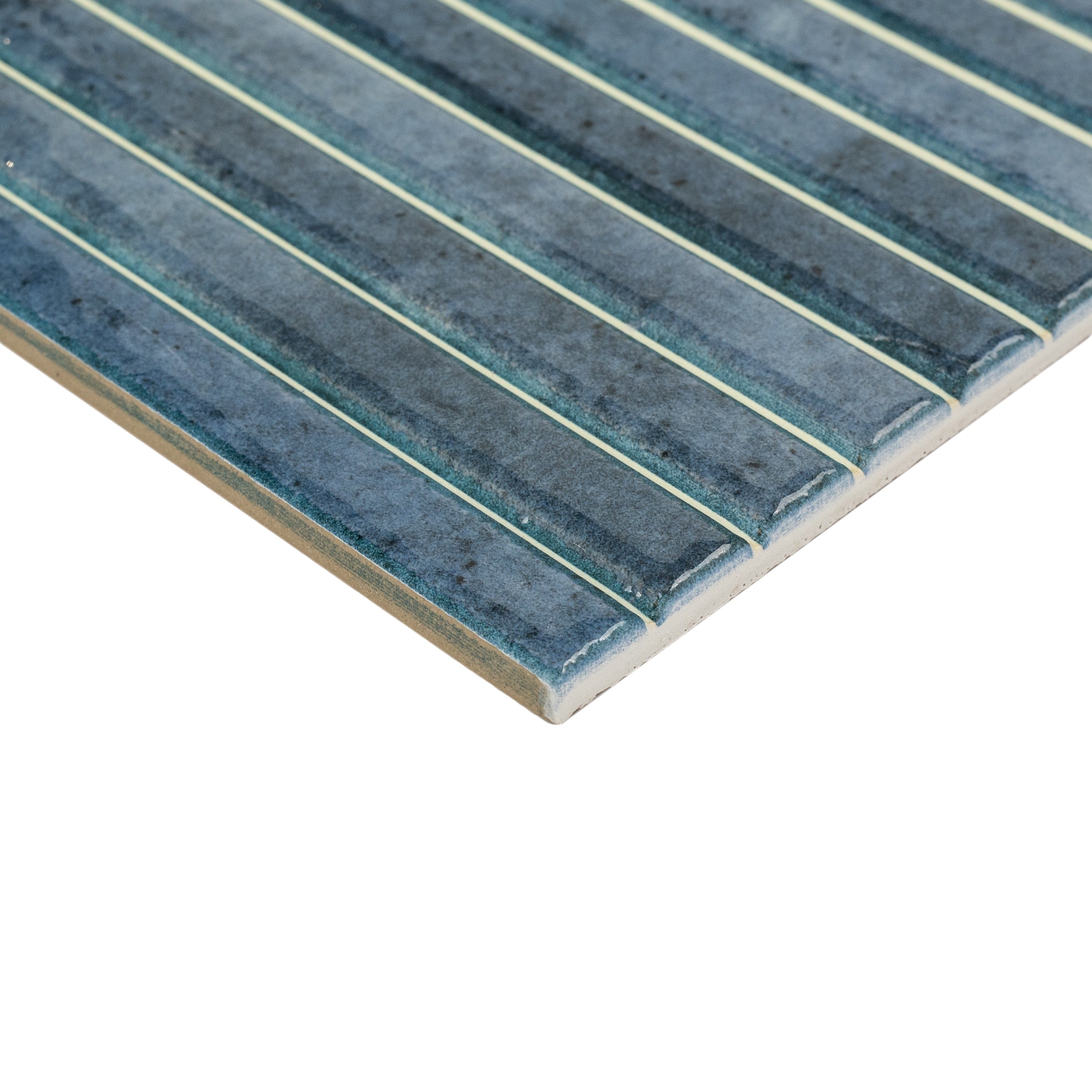 Glossy ceramic tile panel in deep ocean blue with narrow raised vertical lines and subtle color variation
