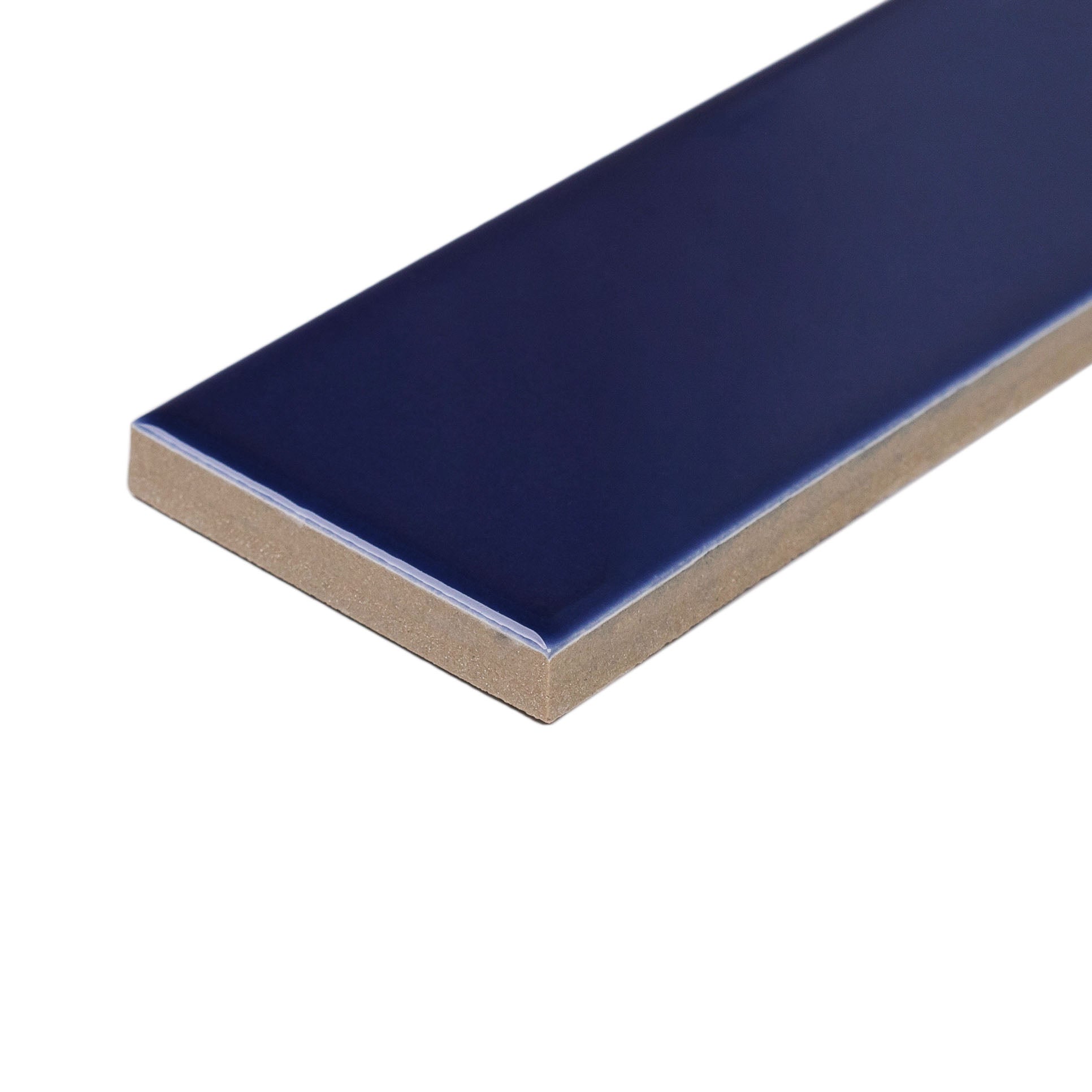 Glossy slim rectangular ceramic tile in deep ocean blue with smooth surface and sharp edges on white background