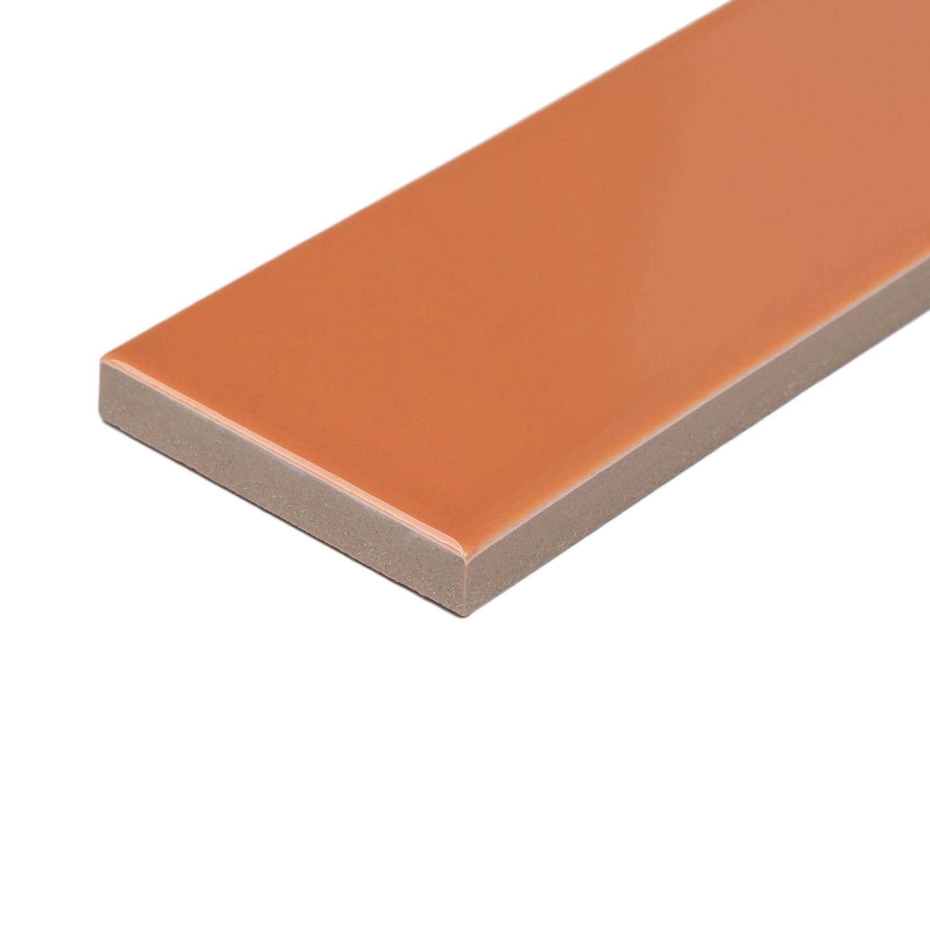 Smooth glossy orange porcelain tile with rectangular shape and clean edges for creative flooring and wall designs