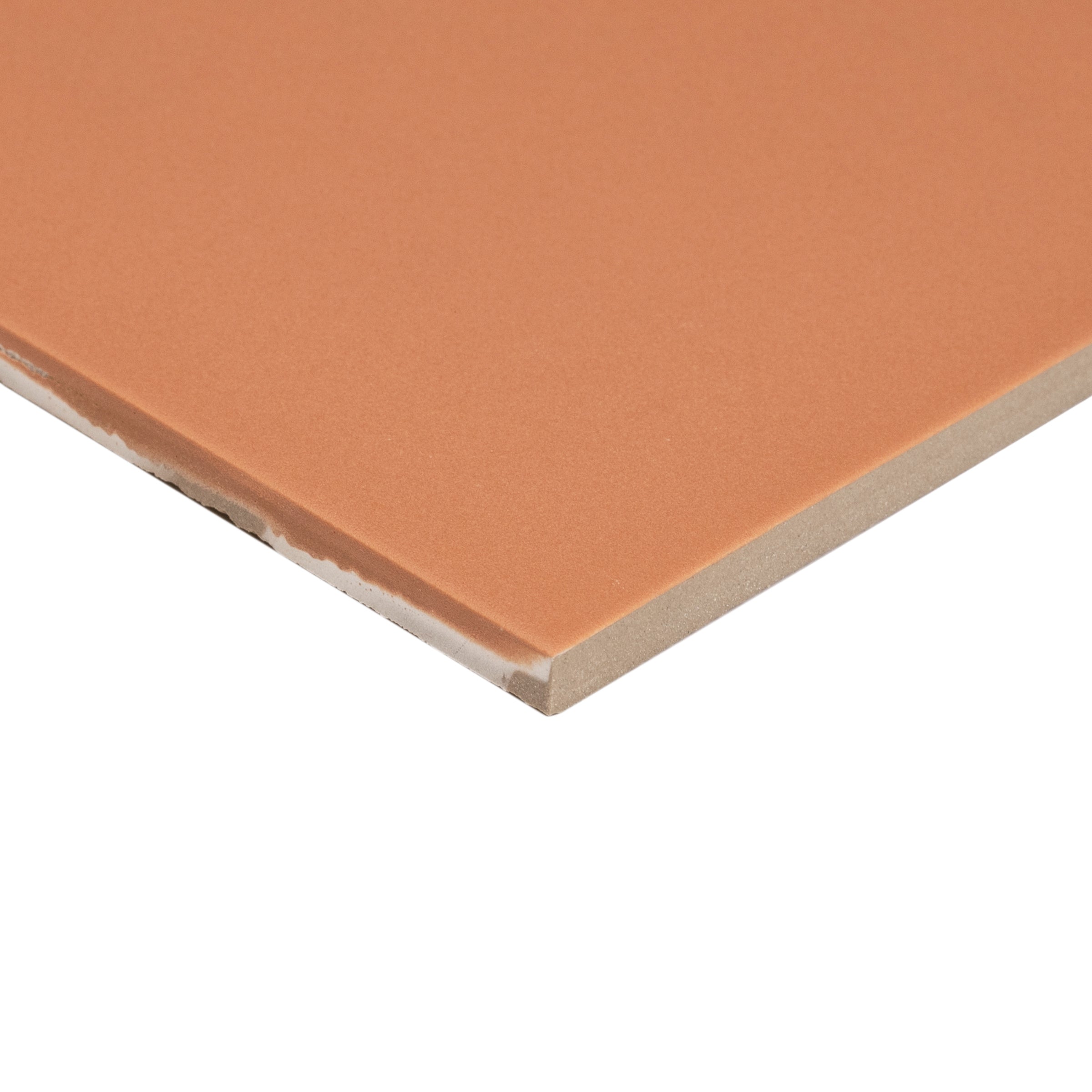 Matte orange porcelain tile corner showing smooth surface and fine edges for creative ceramic tile and flooring designs