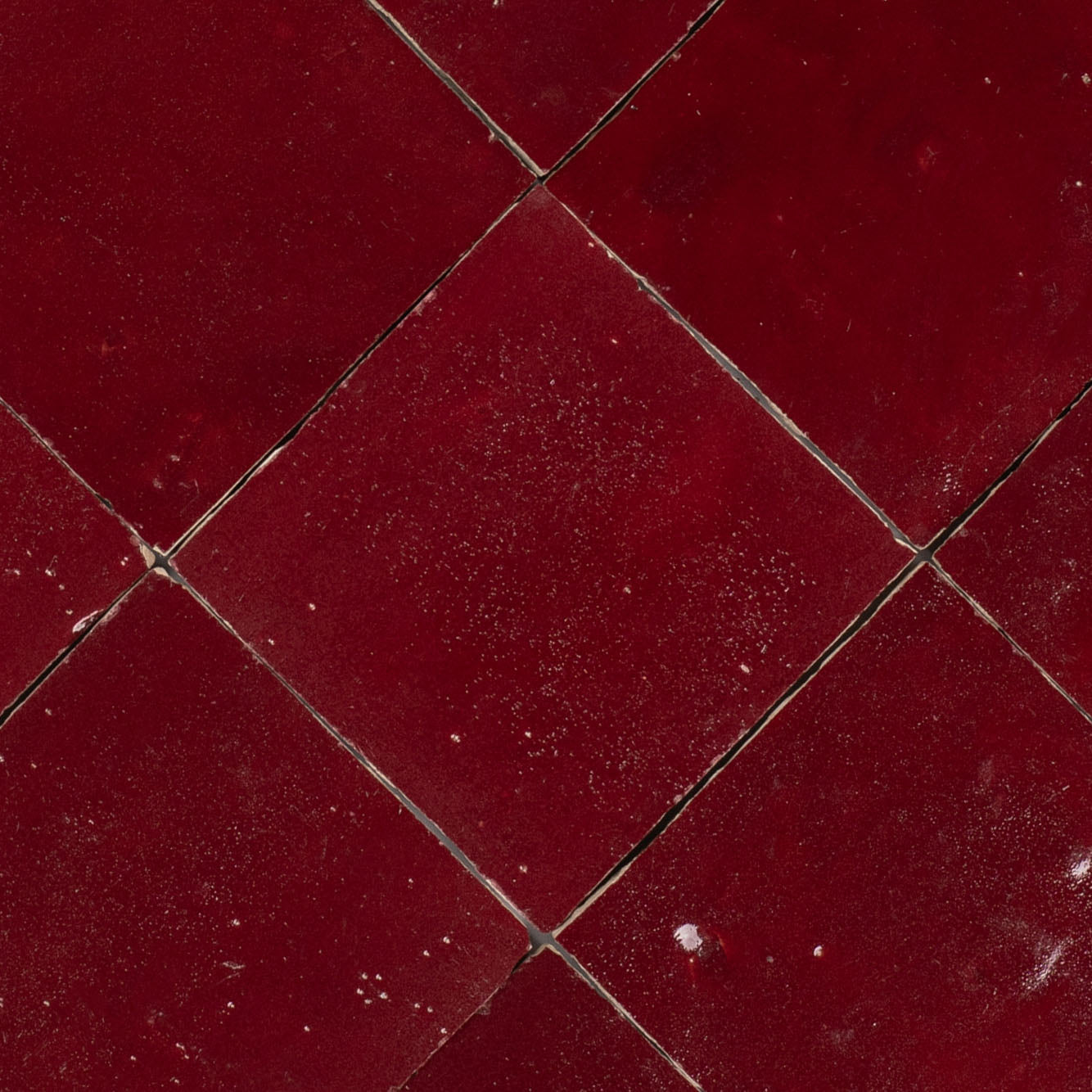Oxblood Glazed Zellige Tile in rich red terracotta showcasing handcrafted charm from Small Format Tiles and Handmade Moroccan Zellige Tiles collections