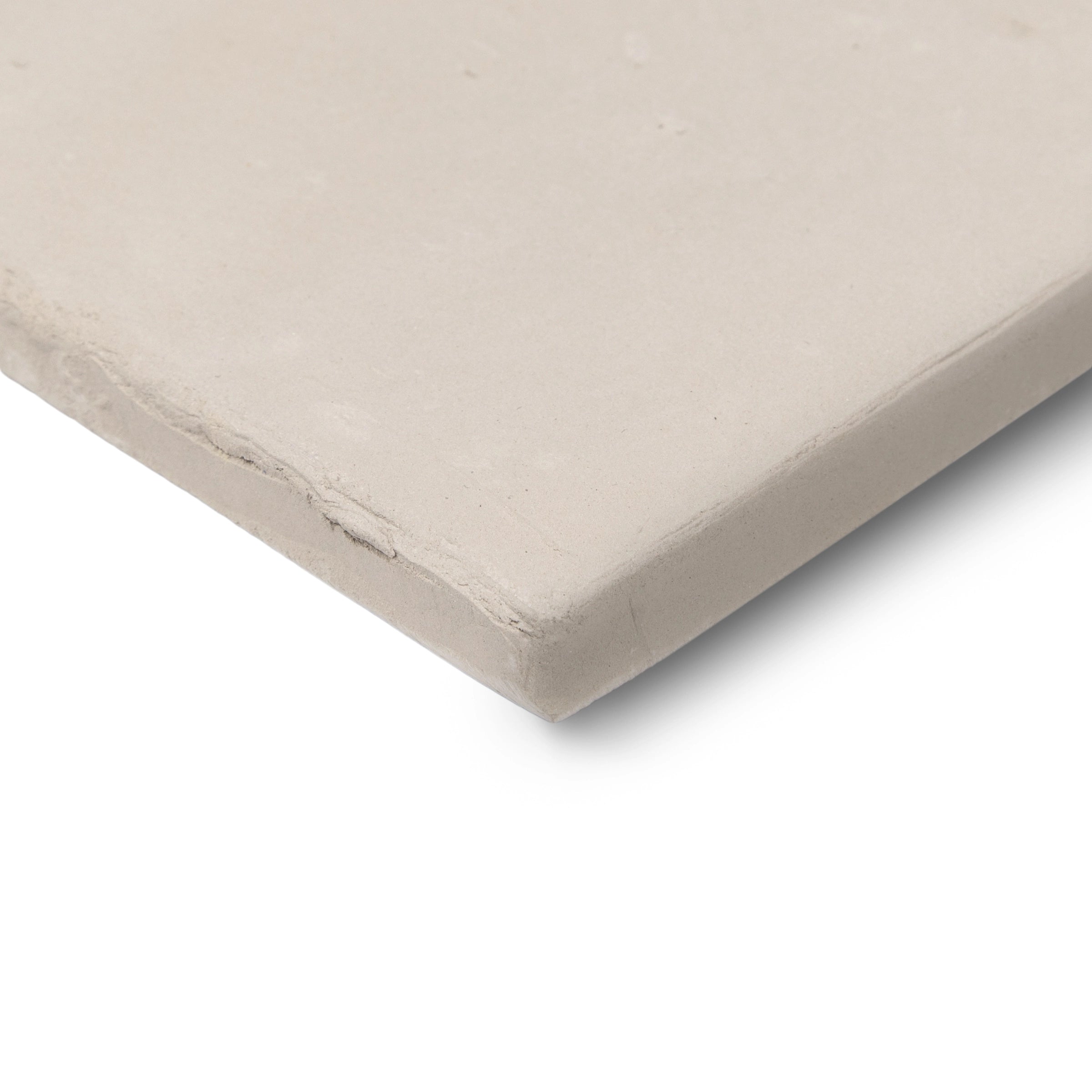 Close-up of a light beige terracotta tile with a smooth matte surface and subtly irregular edges for rustic flooring design