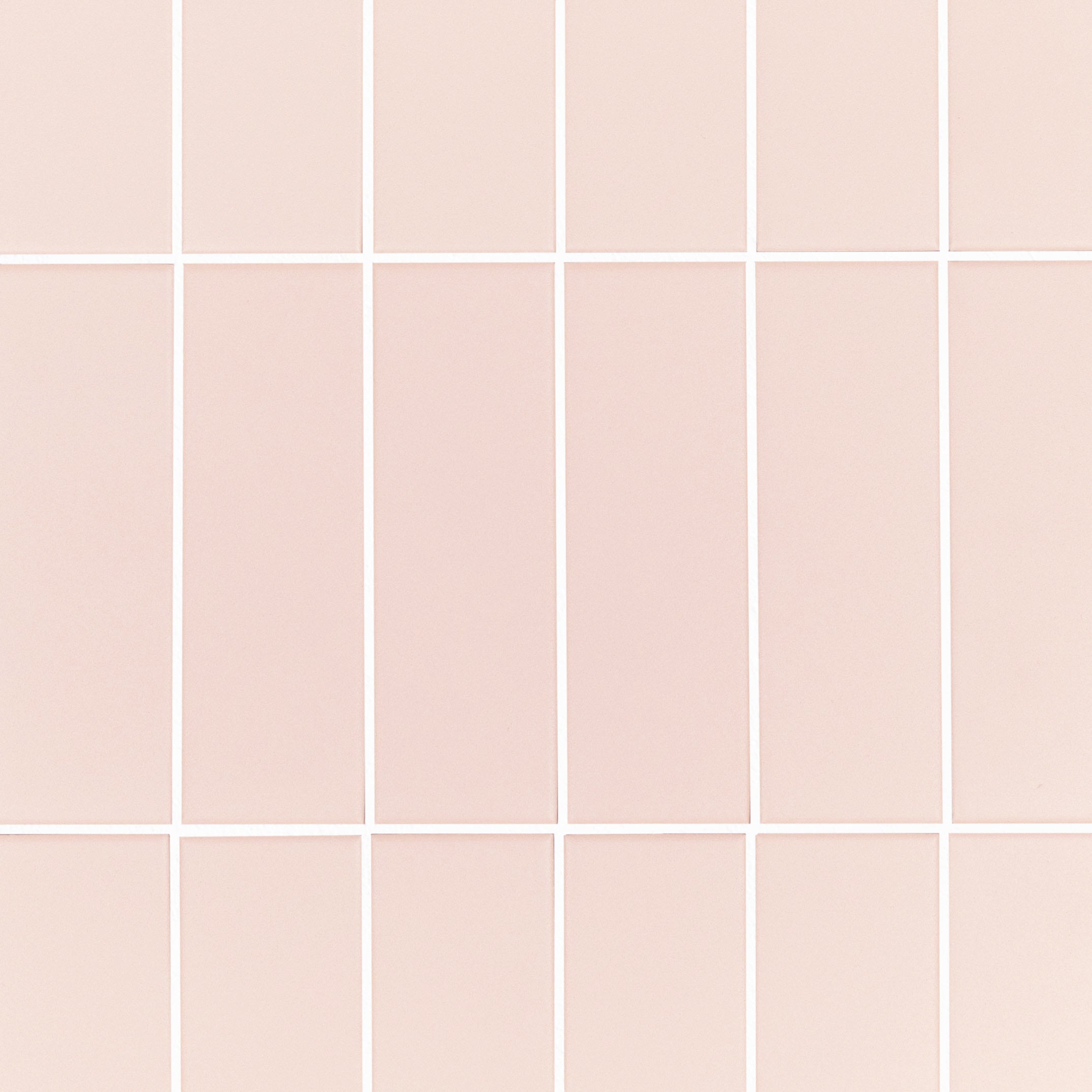 Colorblock Porcelain Tile in soft pink matte finish with clean 2x6 grid layout from Small Format Tiles New Arrivals collection