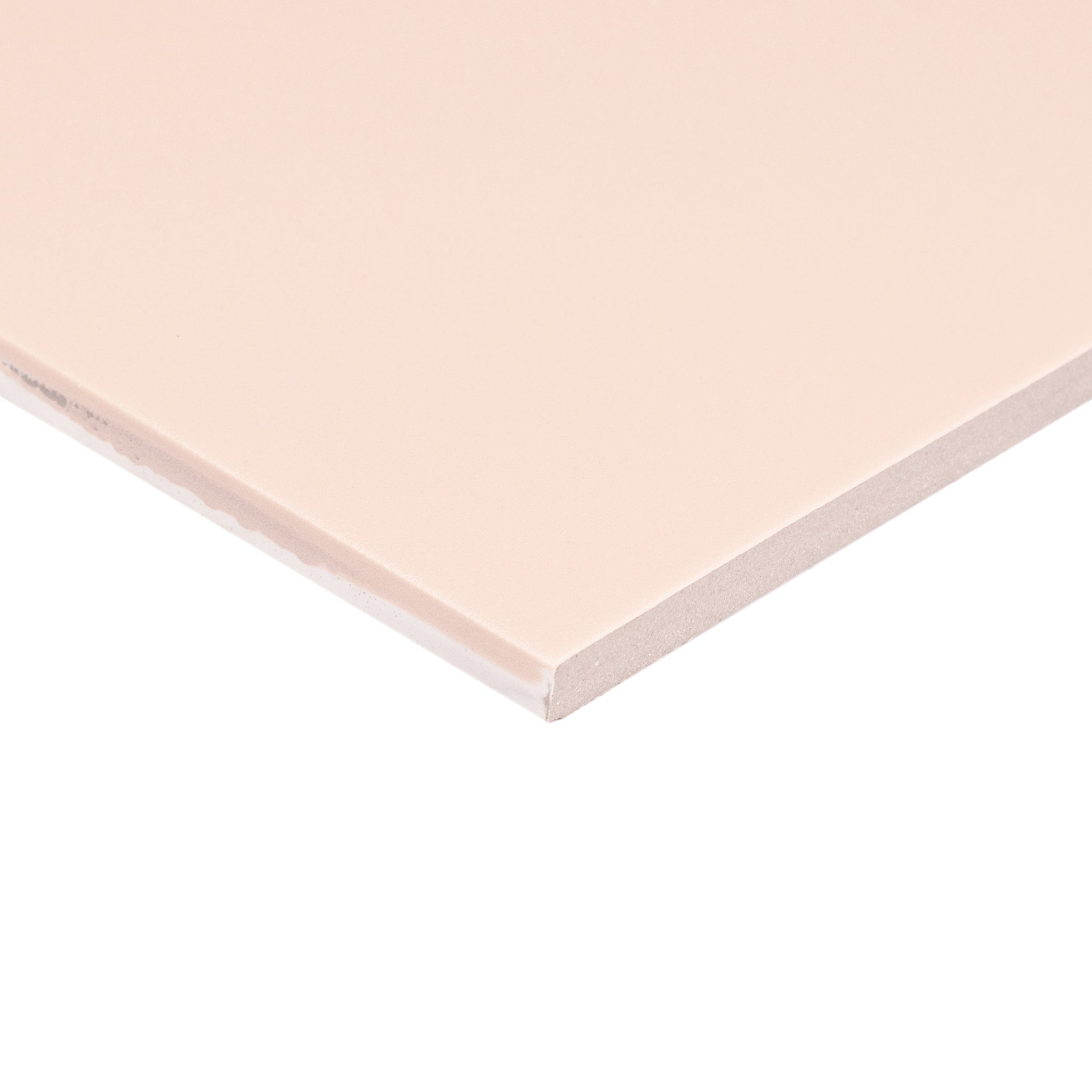 Soft matte porcelain tile in light powder pink with smooth surface and sharp clean edges displayed on white background