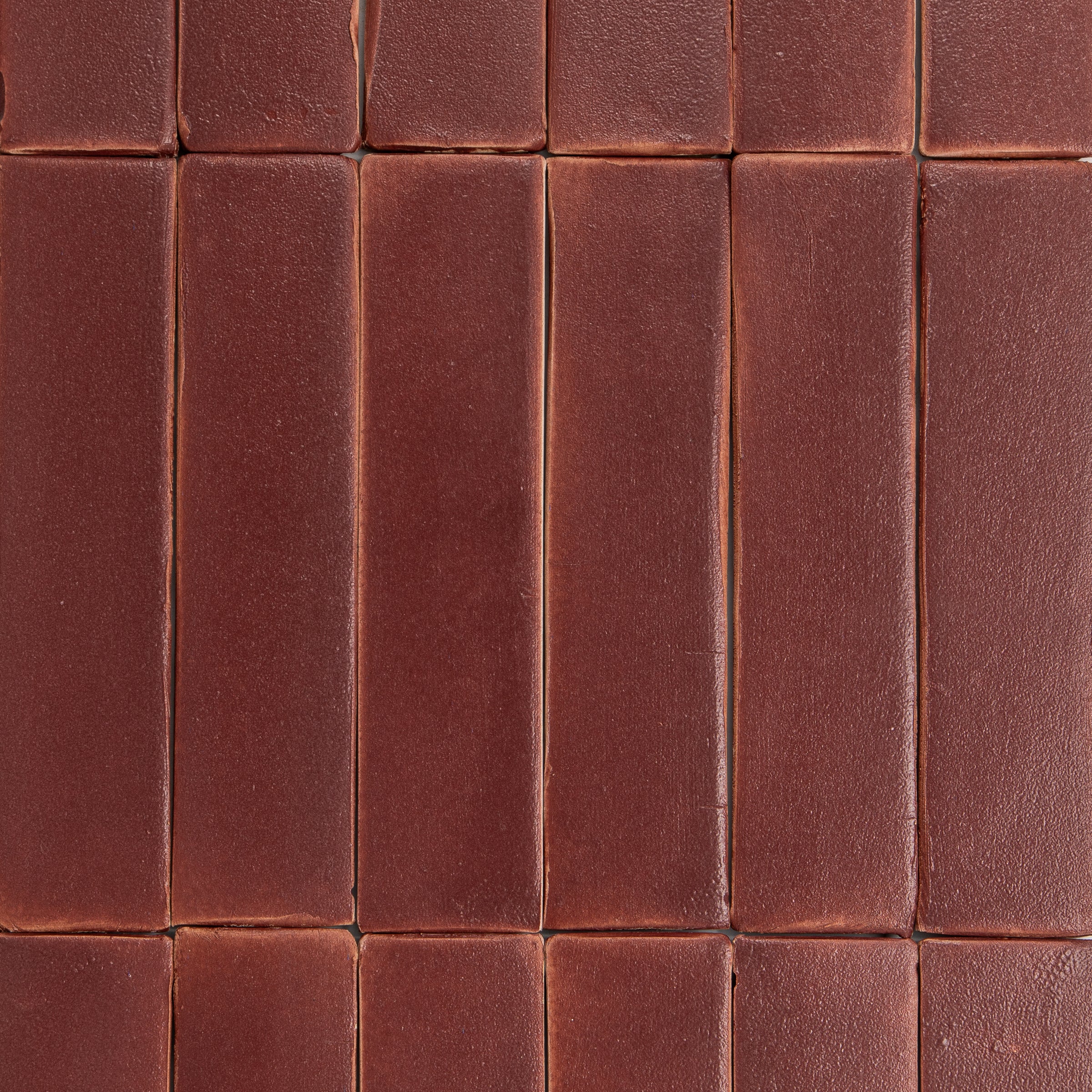 Close-up of brown ceramic tiles with a grid pattern