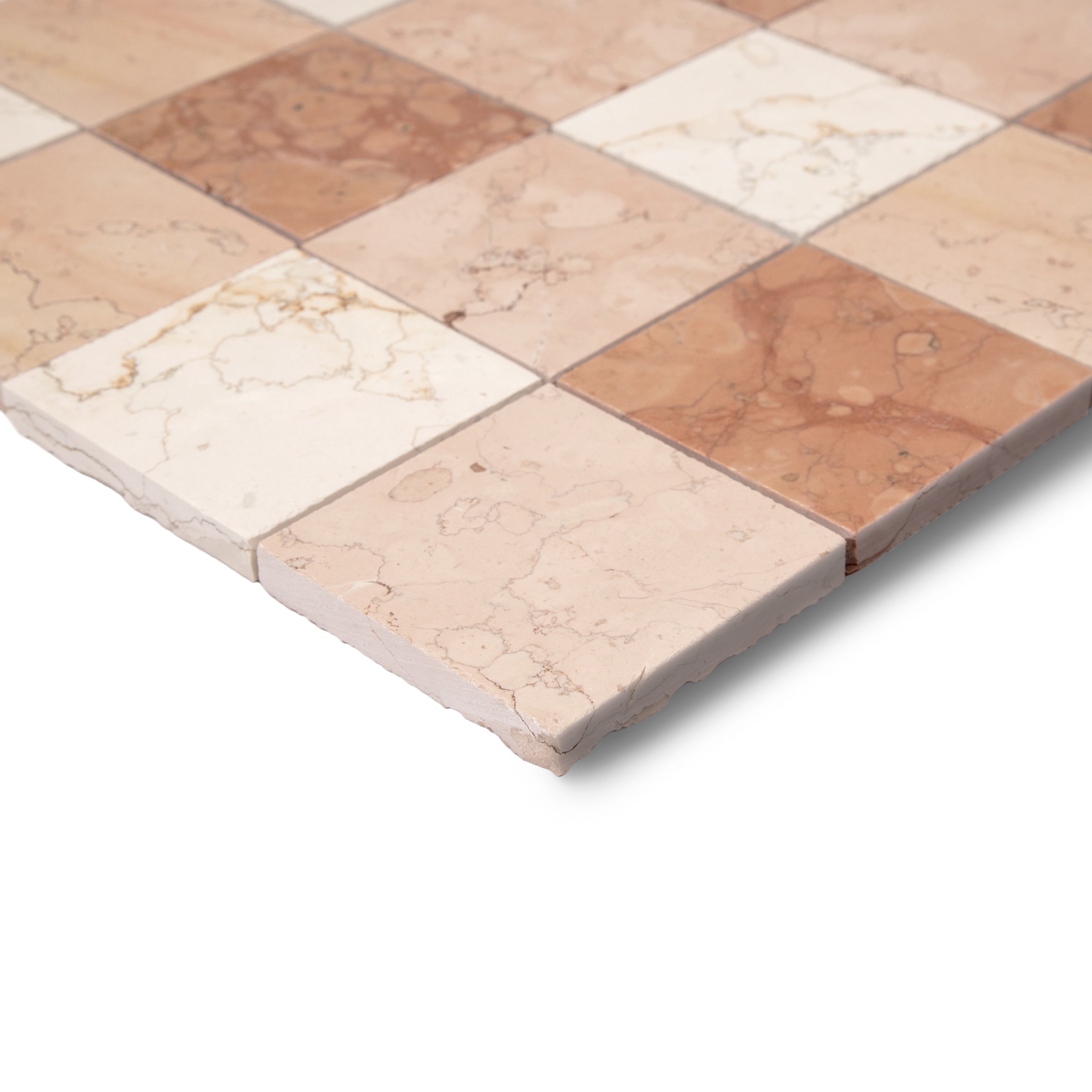 Checkerboard arrangement of natural stone tiles in soft beige, cream, and warm terracotta tones with subtle veining details