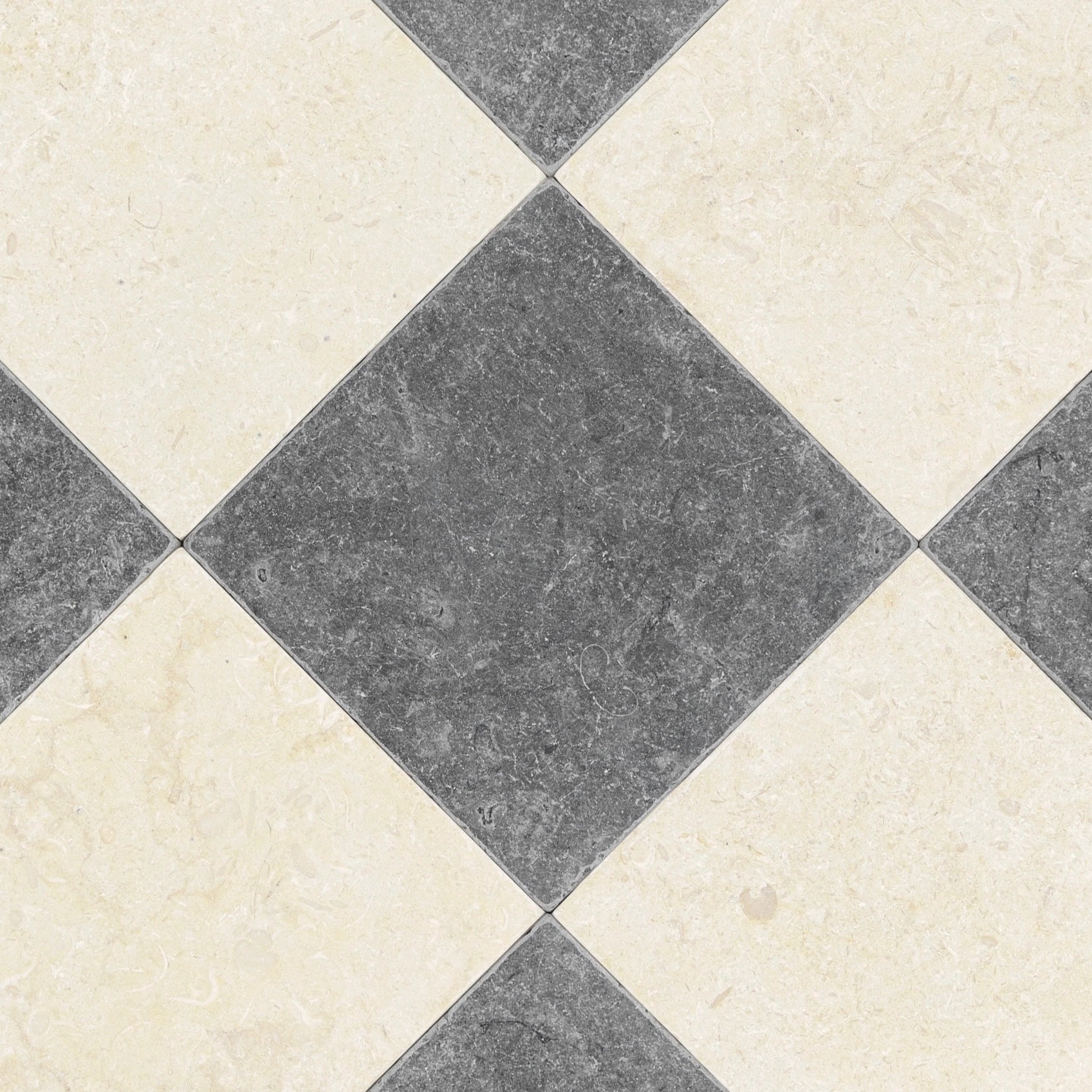 Diagonal pattern of square tiles alternating dark gray and creamy beige with subtle natural stone texture