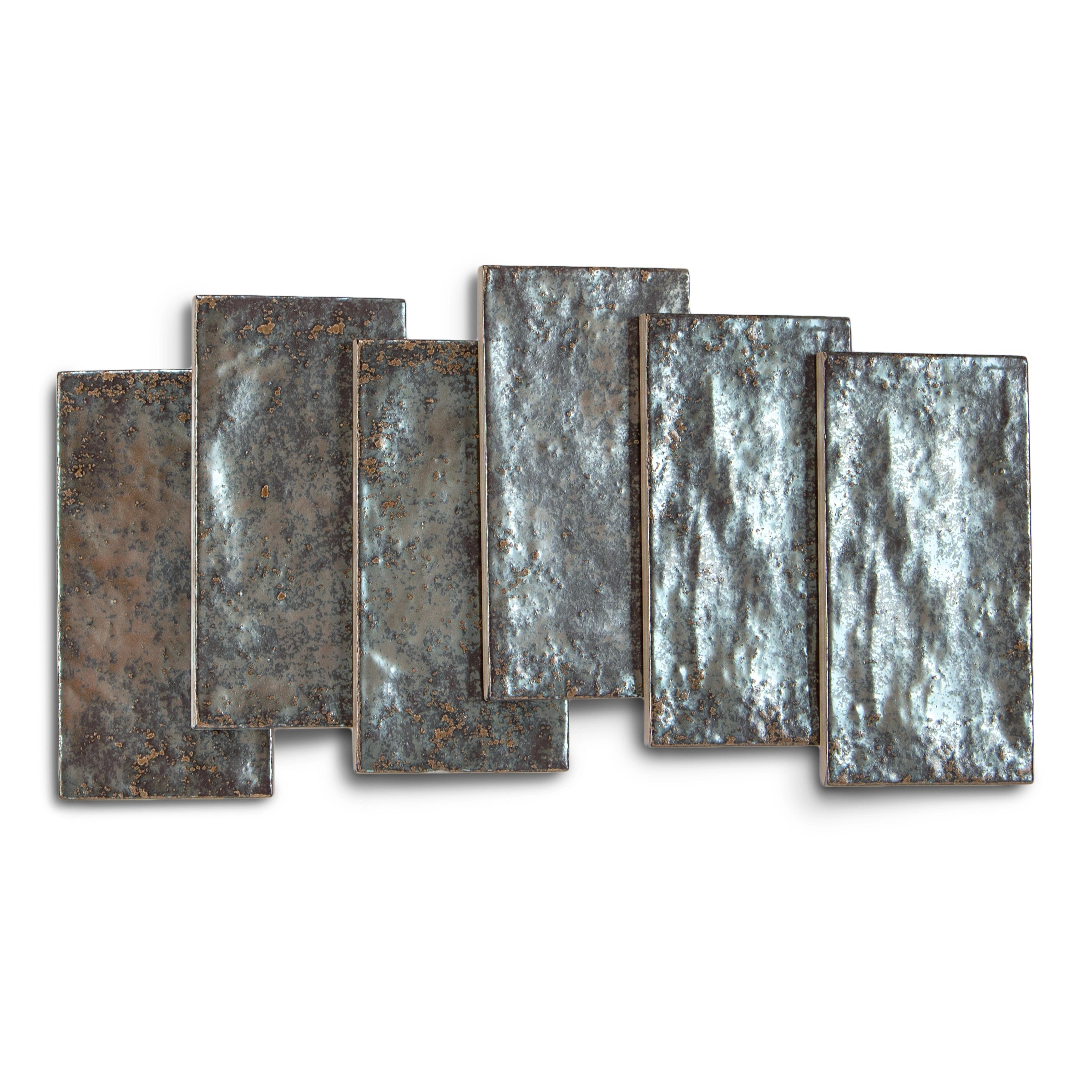 Six rectangular ceramic tiles in aged silver tones with a textured, reflective surface and subtle variations