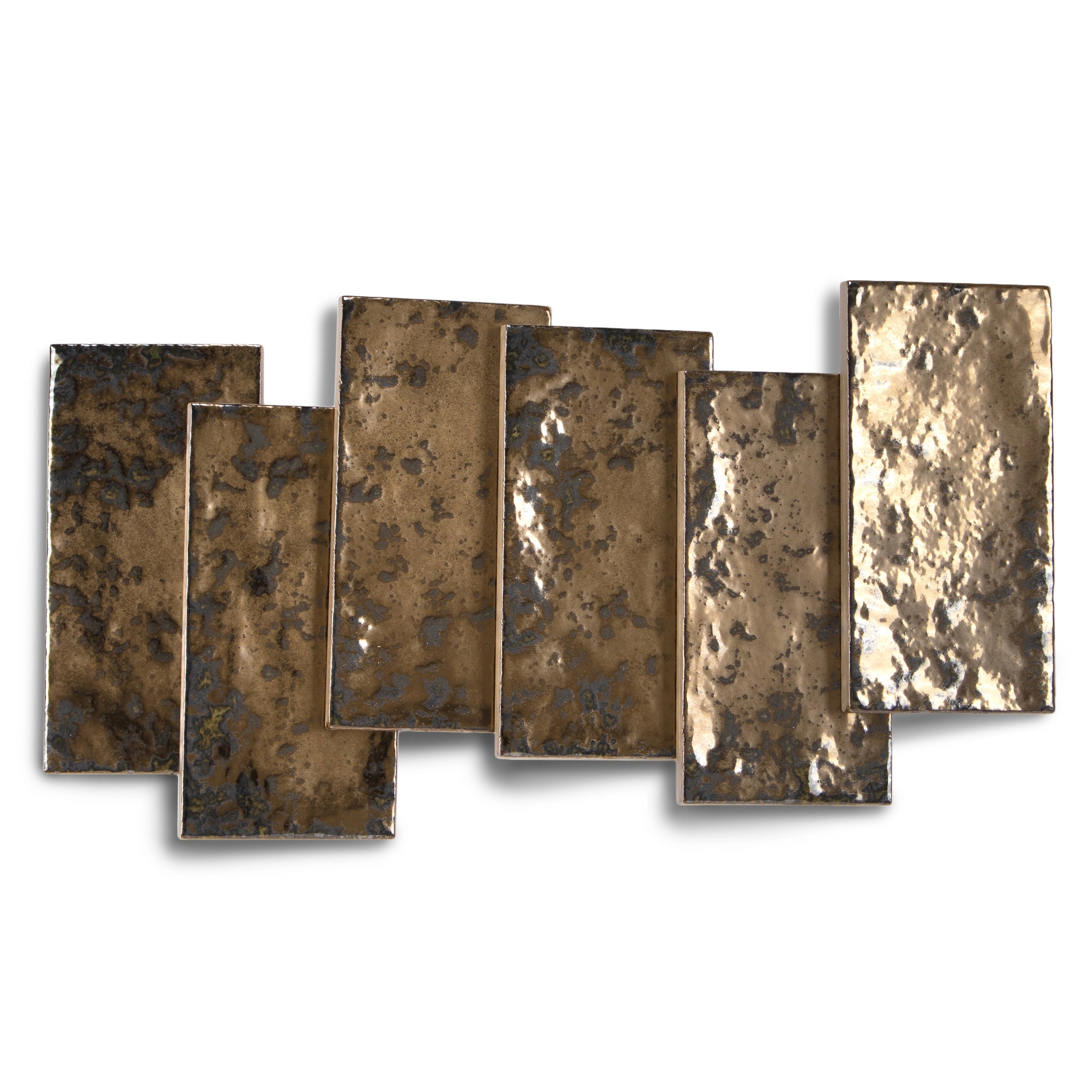Seven rectangular porcelain tiles in metallic bronze shades with a burnished, textured surface and varied reflective patterns