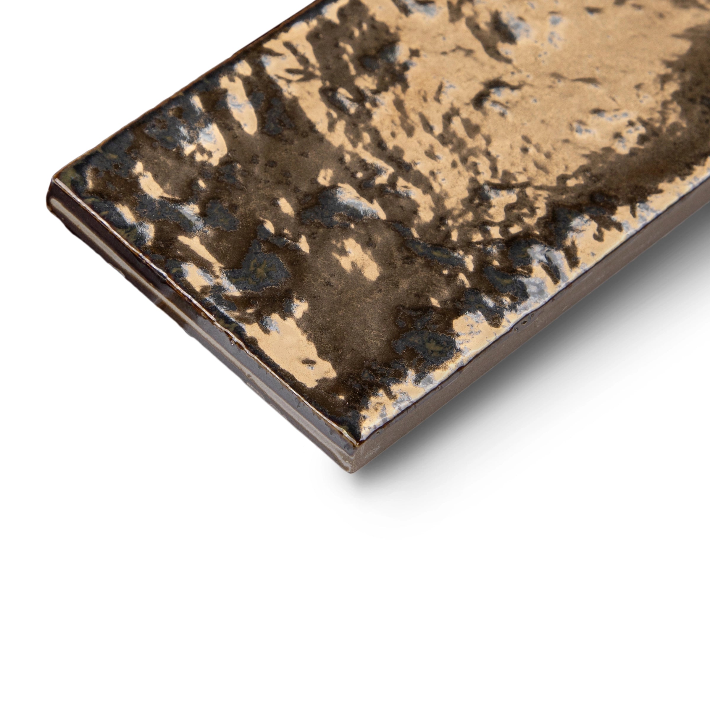 Rectangular porcelain tile in rich bronze tones with a burnished, glossy surface and organic textured patterns