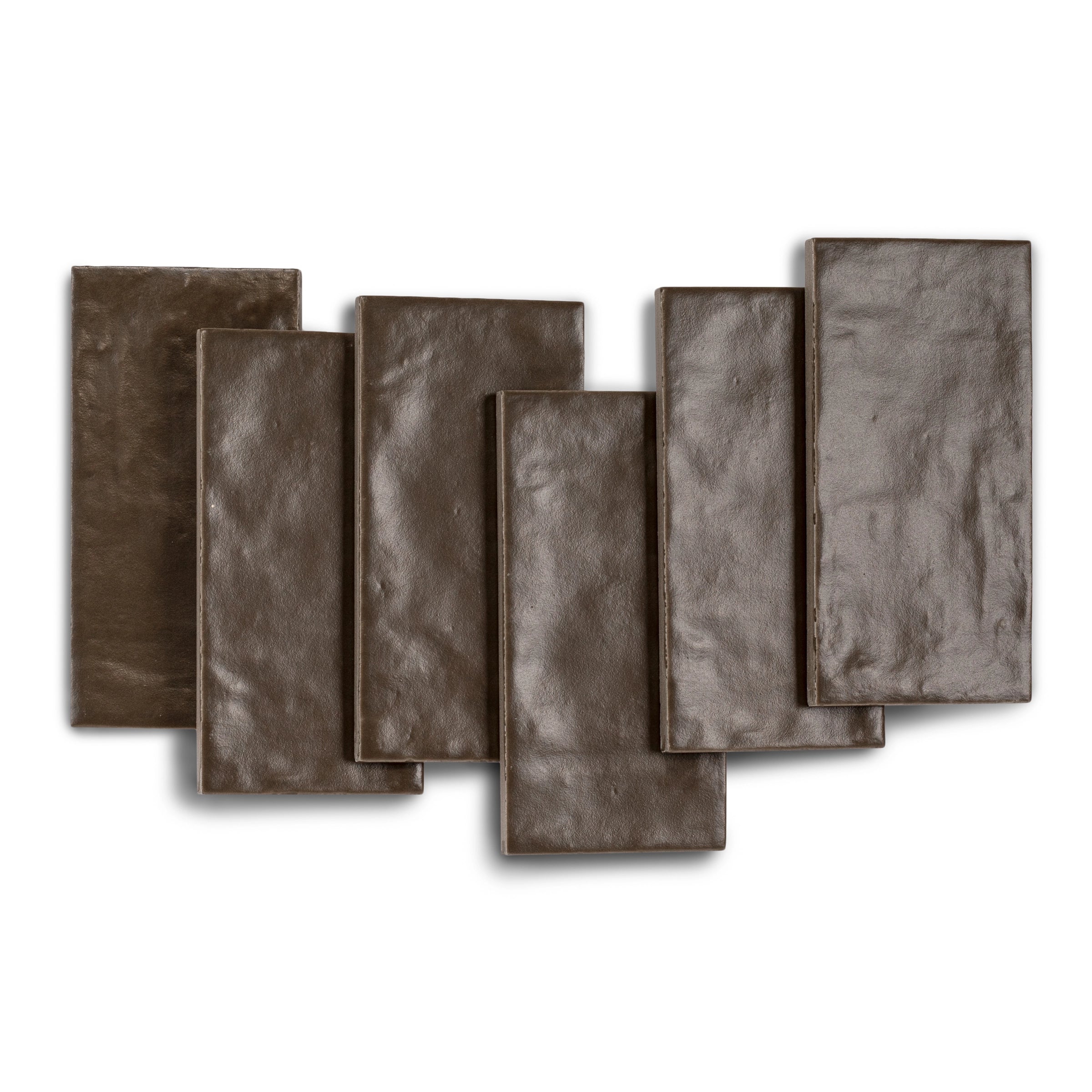 Collection of six narrow rectangular ceramic tiles in deep earthy brown with a subtle textured surface and natural tones