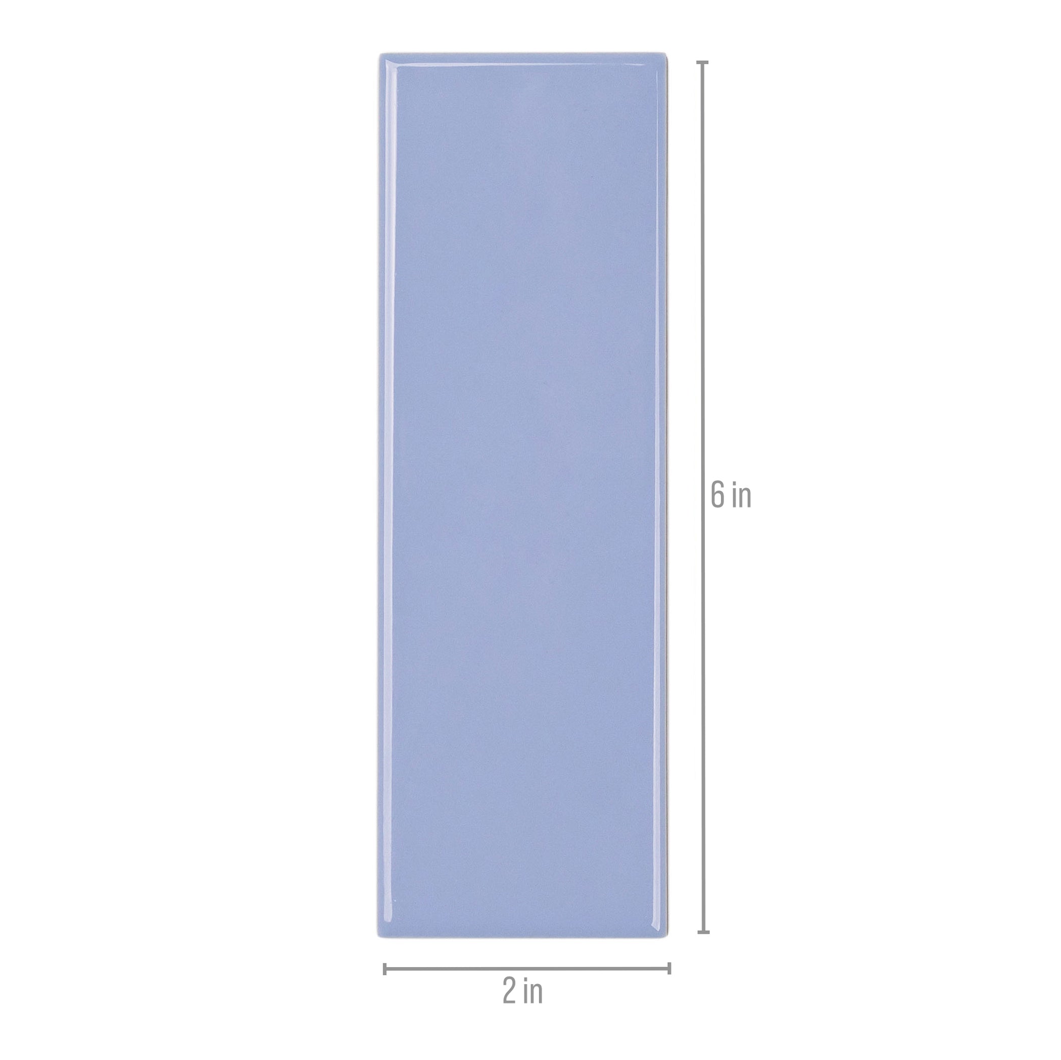 Slim rectangular ceramic tile in muted sky blue with glossy finish and smooth edges on white backdrop