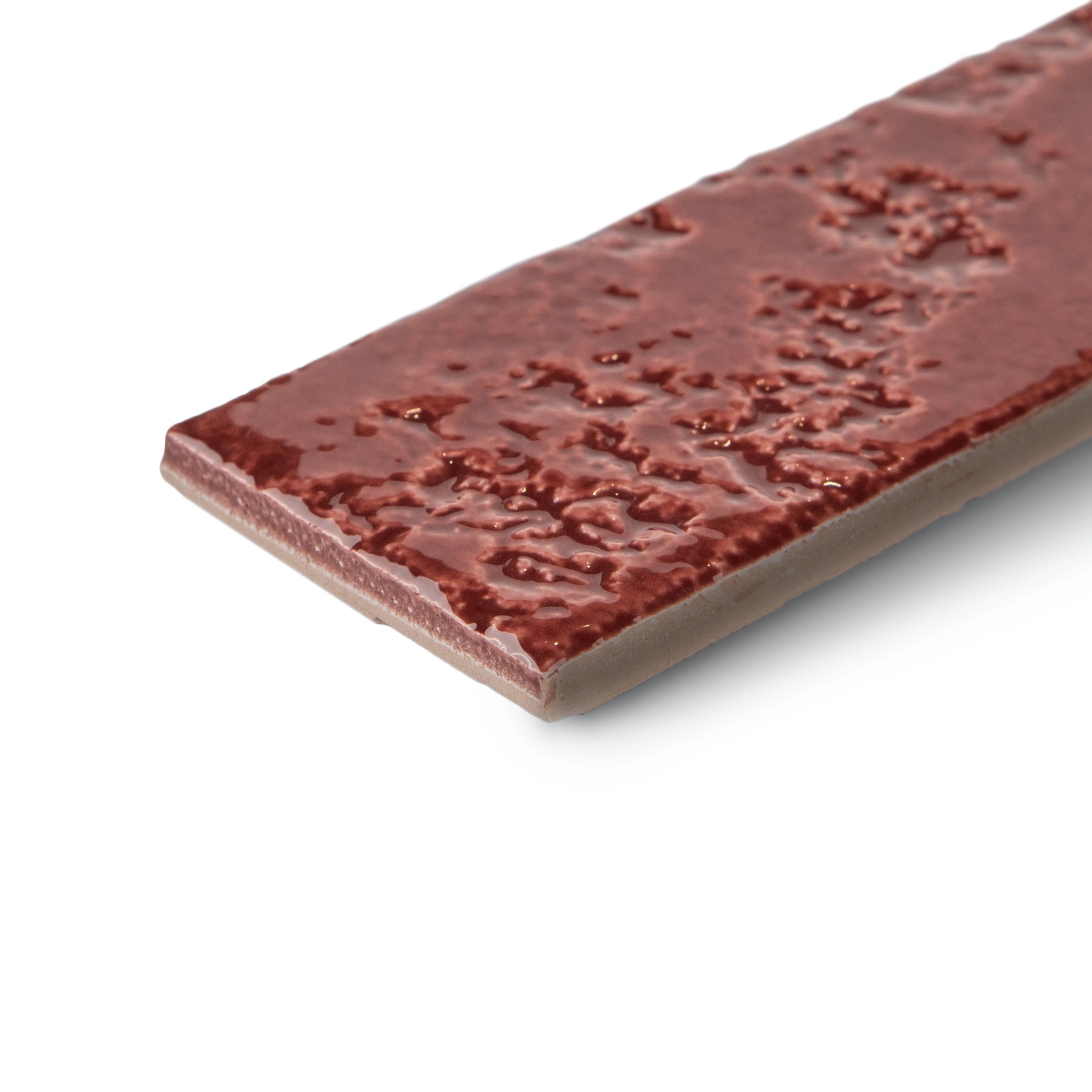 Deep reddish narrow ceramic tile with a glossy, uneven textured surface shown on a white background