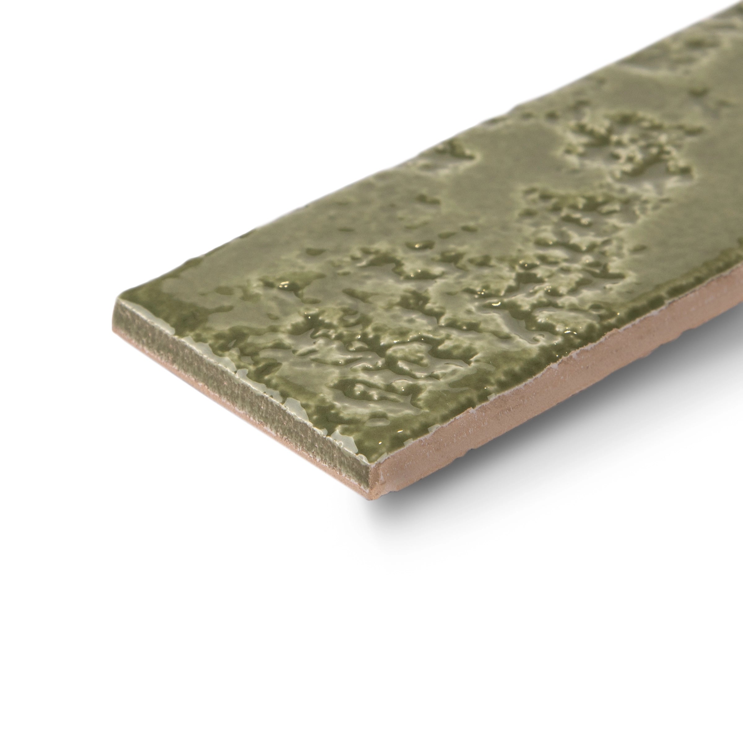 Narrow green ceramic tile with a textured, glossy surface highlighting a handcrafted, irregular pattern on a white background