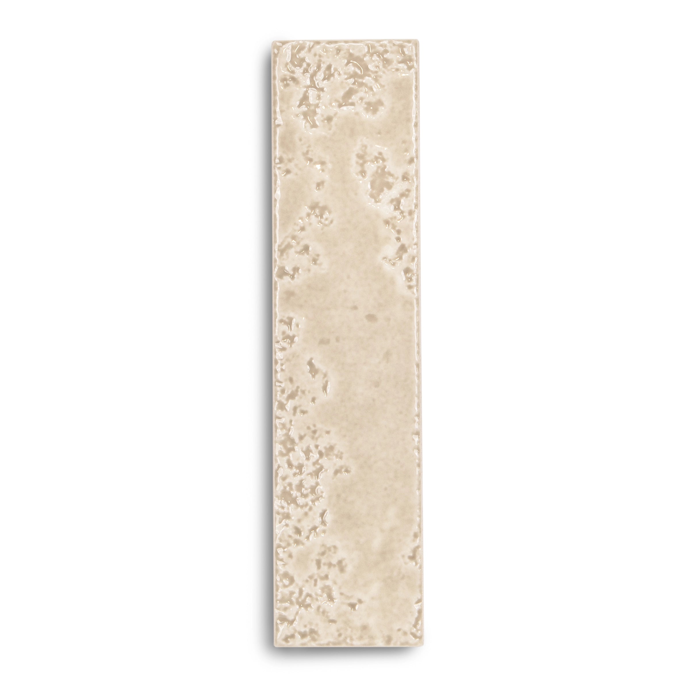 Narrow rectangular ceramic tile with a matte beige surface featuring subtle mottled texture and soft edges