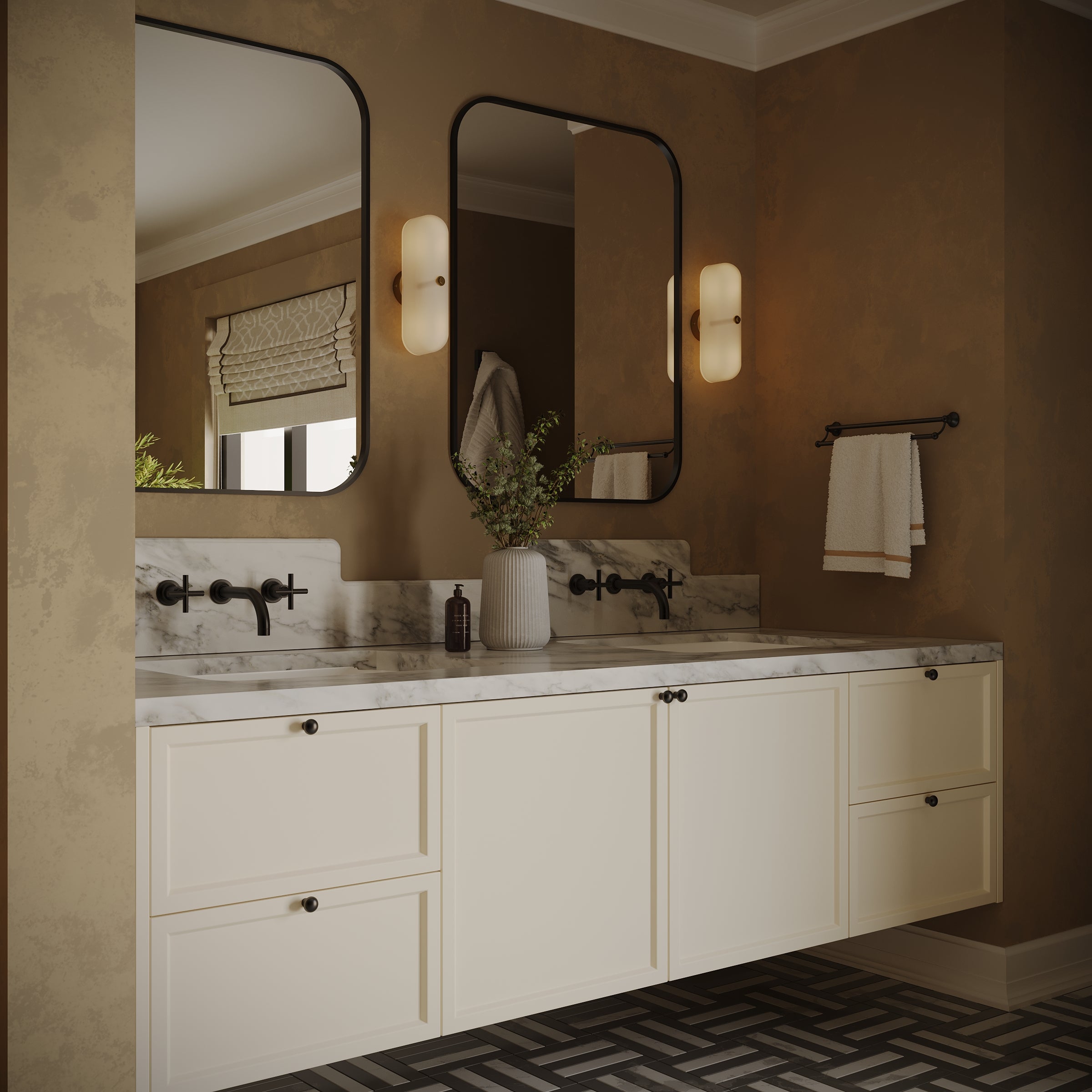 Double vanity with cream cabinetry, marble countertop, rounded mirrors, wall sconces, and geometric patterned floor tiles