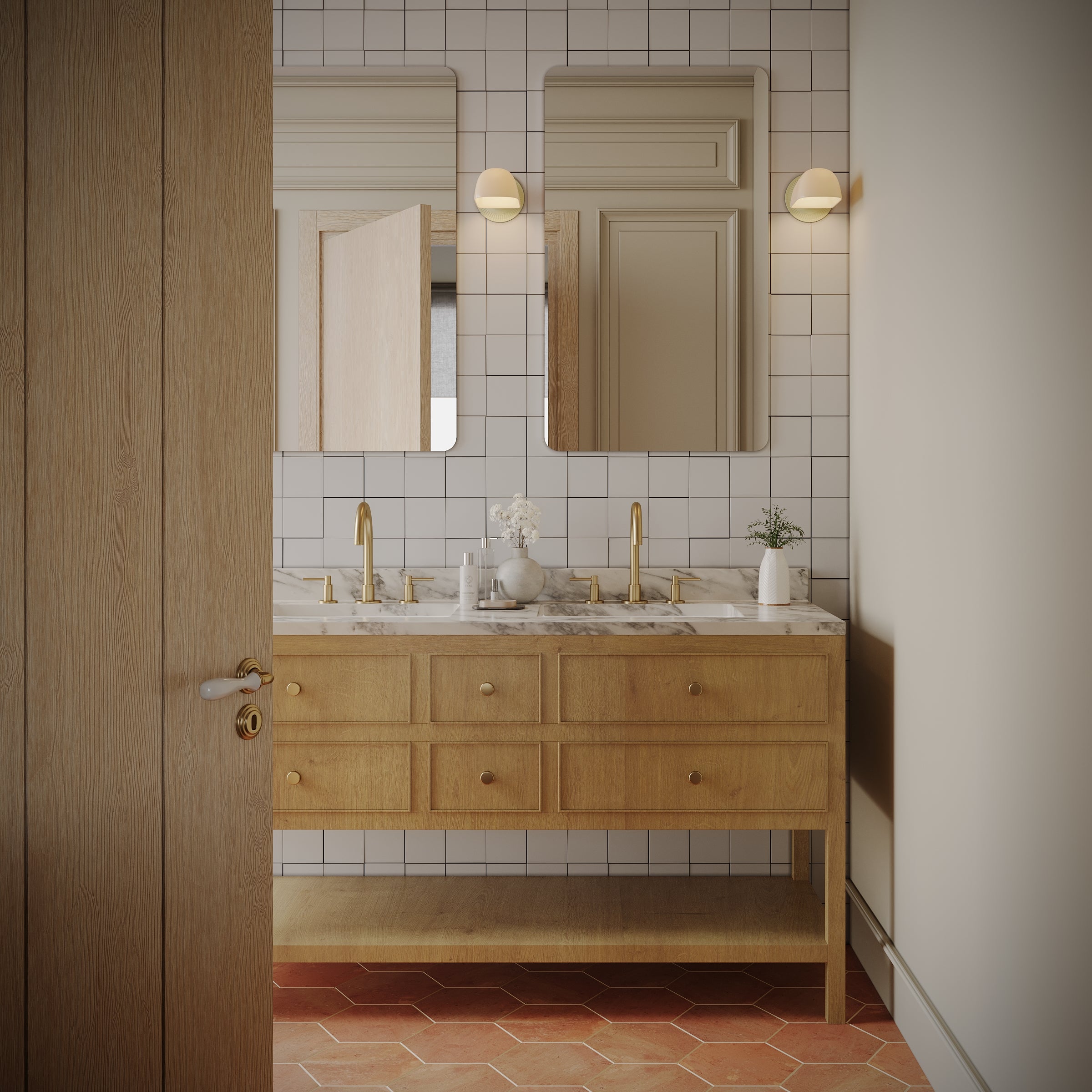 Light oak double sink vanity with marble countertop, gold fixtures, two rectangular mirrors, white square tile wall, and terracotta floor tiles