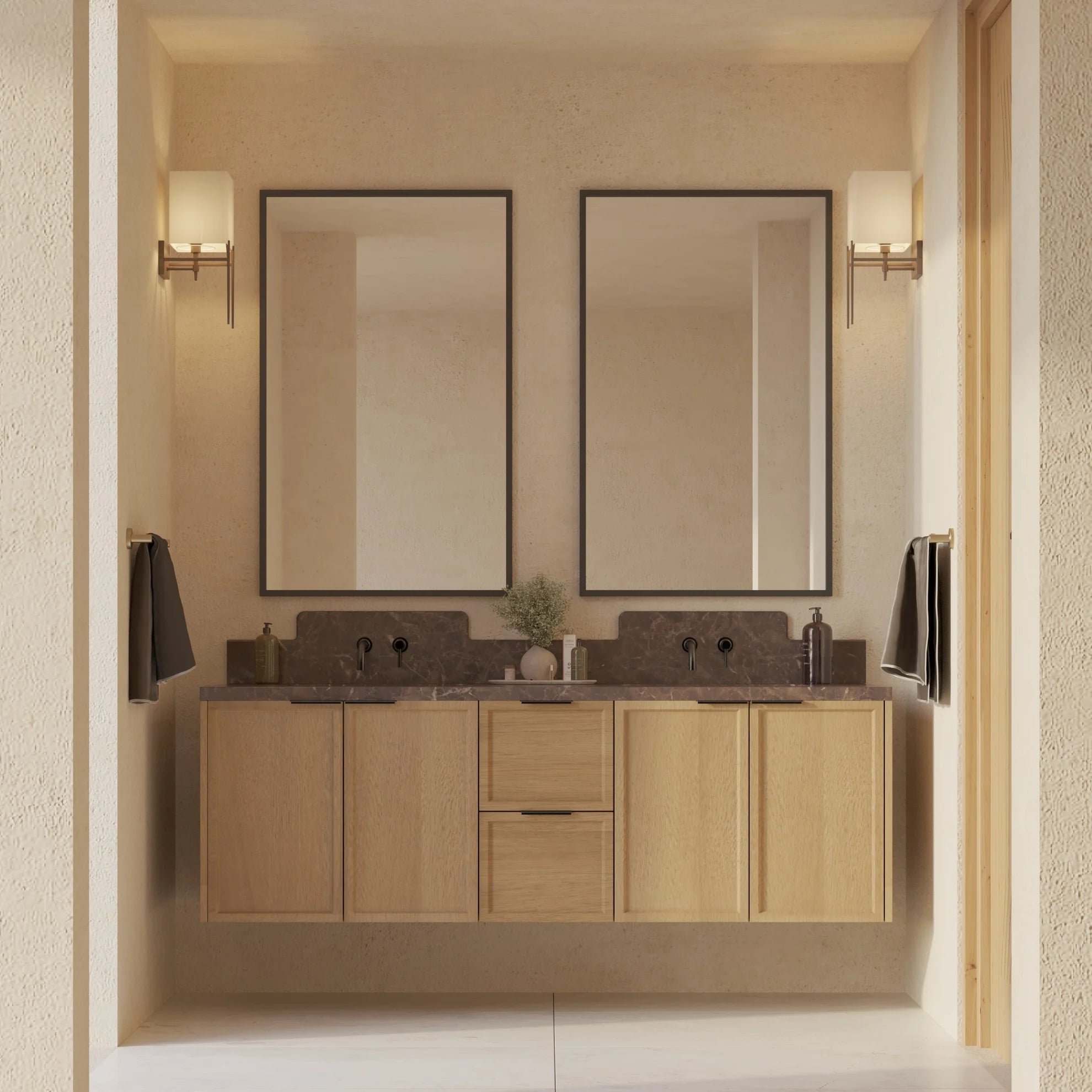 Minimalist double vanity with wood cabinetry, stone countertop, two rectangular mirrors, wall sconces, and neutral textured walls.