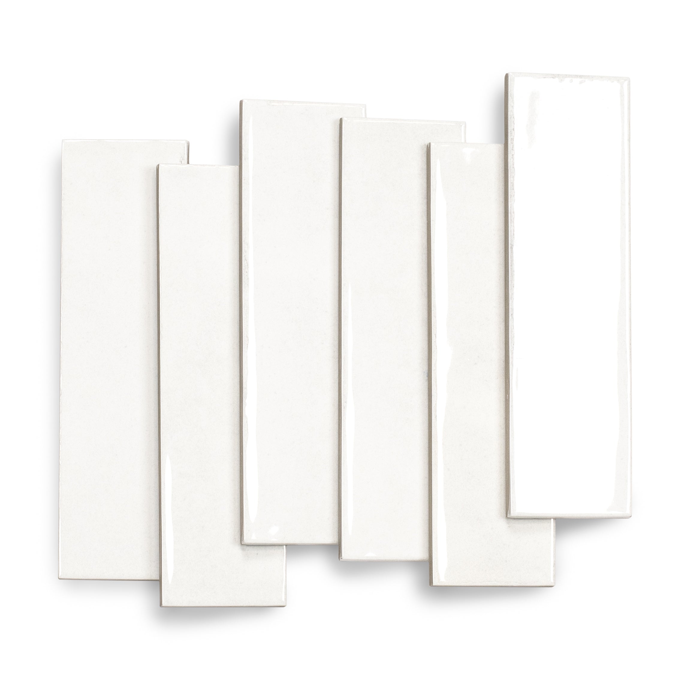 Glossy white ceramic tiles with slight imperfections arranged overlapping on a white background