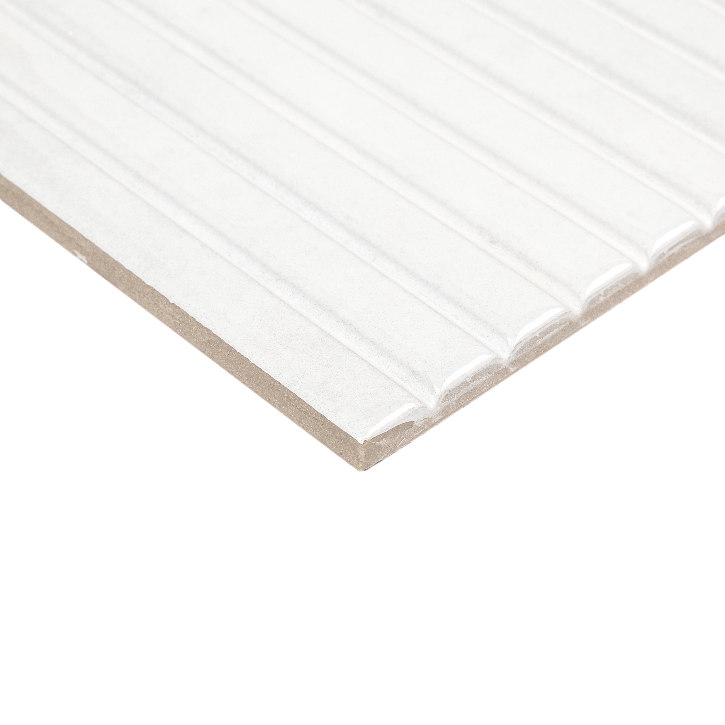 Close-up of white ceramic tile edge with raised vertical stripes and matte finish for contemporary design ideas