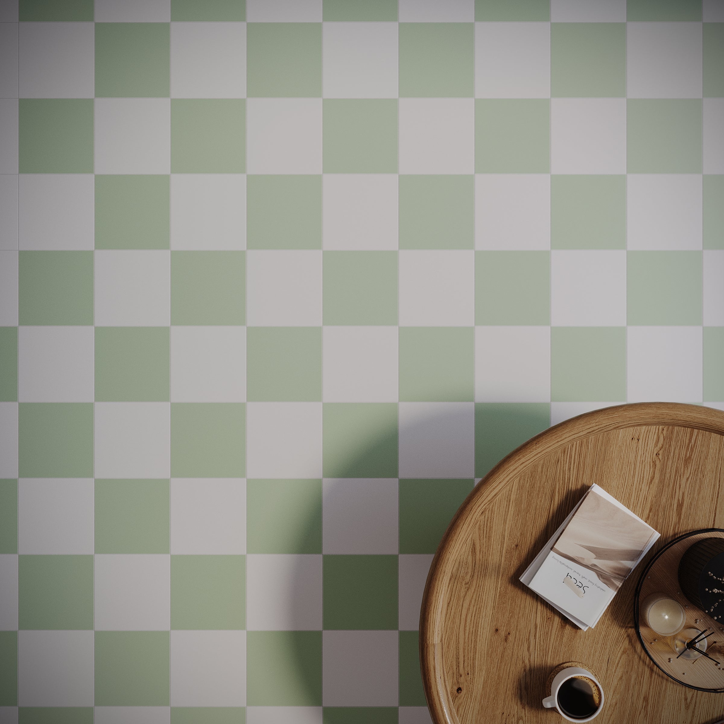 Matte porcelain tiles in a soft mint and white checkerboard pattern beside a round wooden table with coffee and book