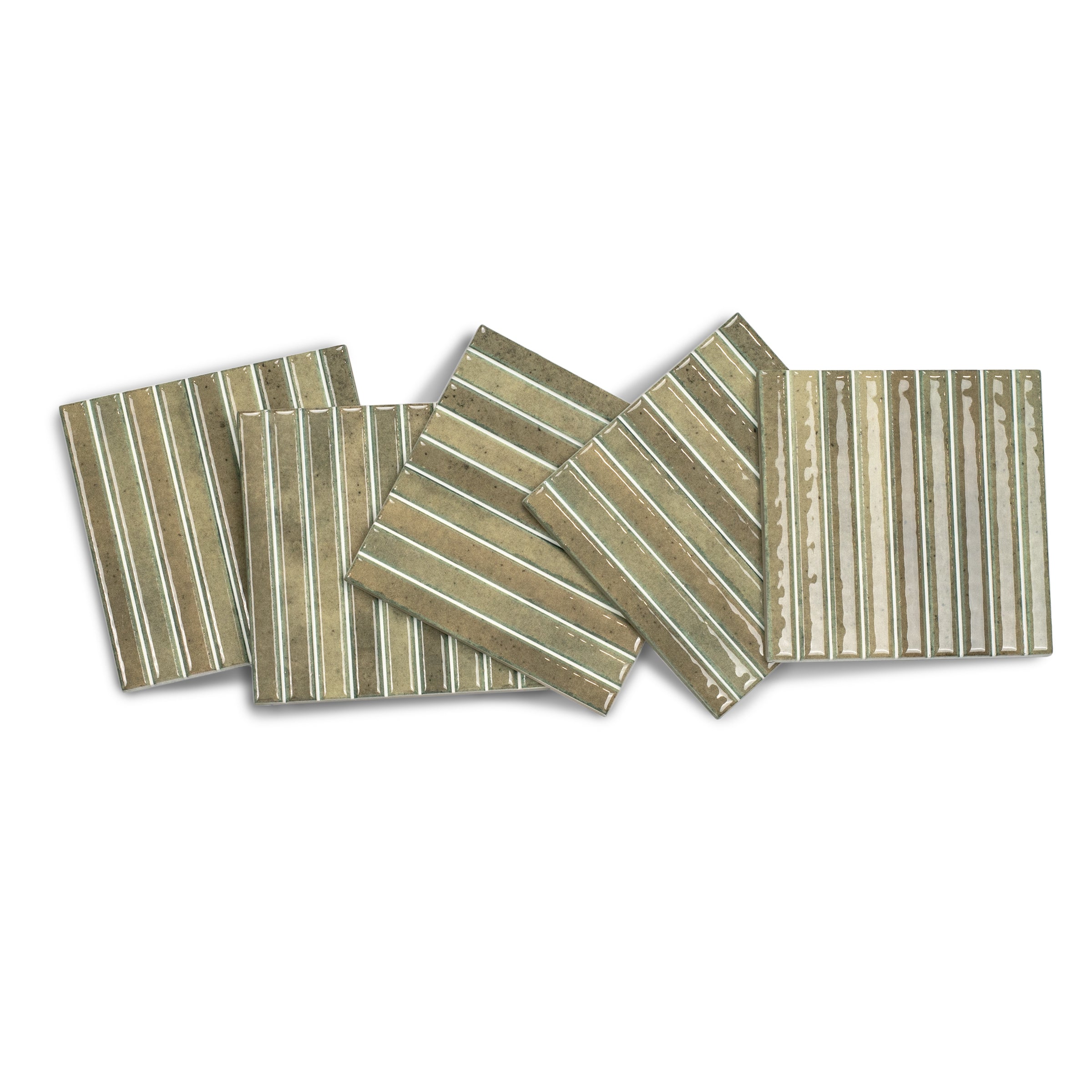 Set of beige ceramic tiles with glossy finish and raised vertical stripes creating a textured linear pattern