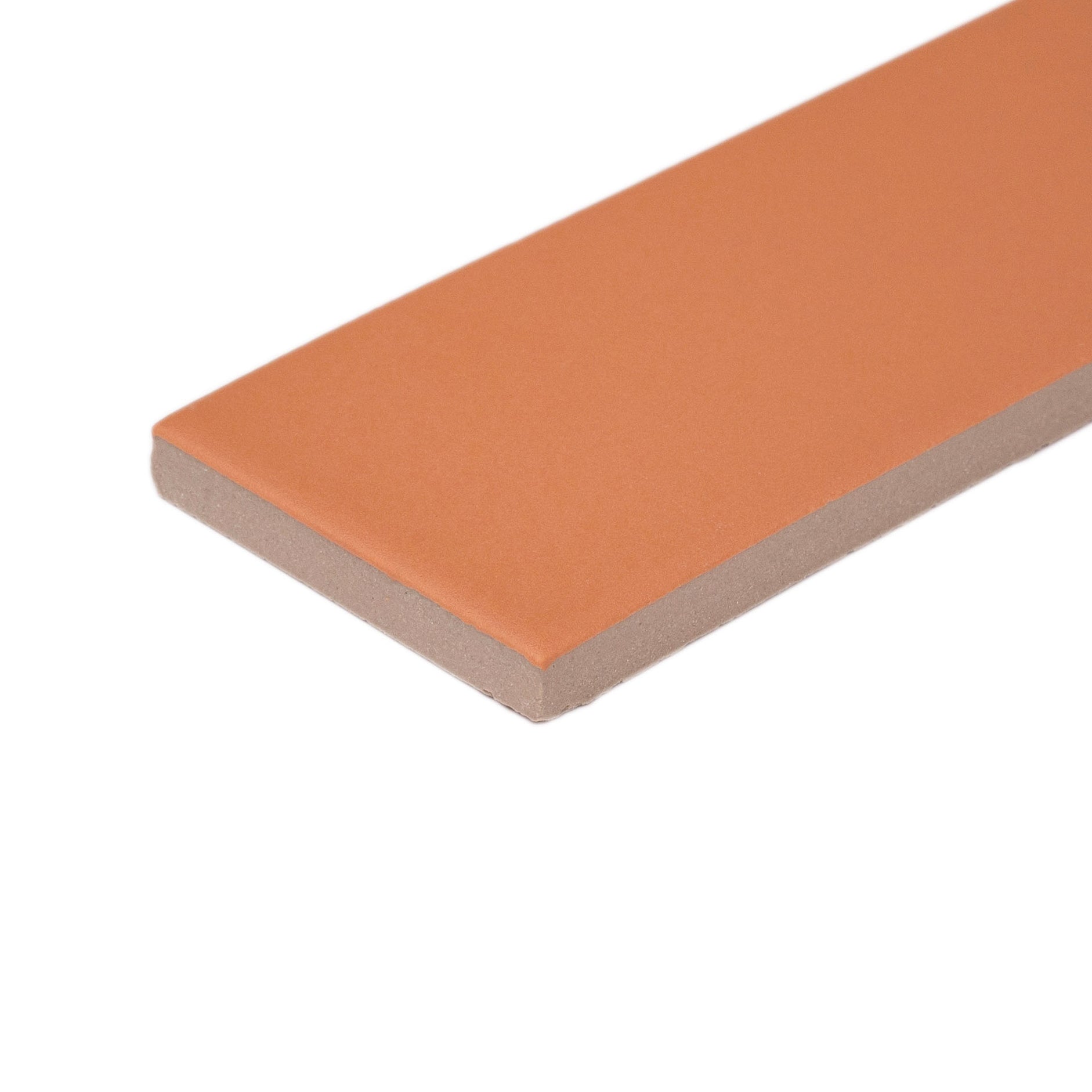 Matte burnt orange porcelain tile with smooth surface and clean edges showcasing a rectangular shape for flooring ideas